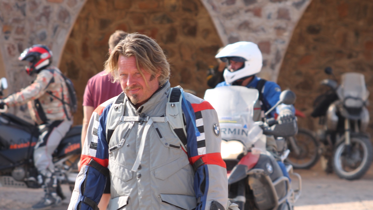 BMW R1200GS loaded for touring on a gravel road, 2012 model.