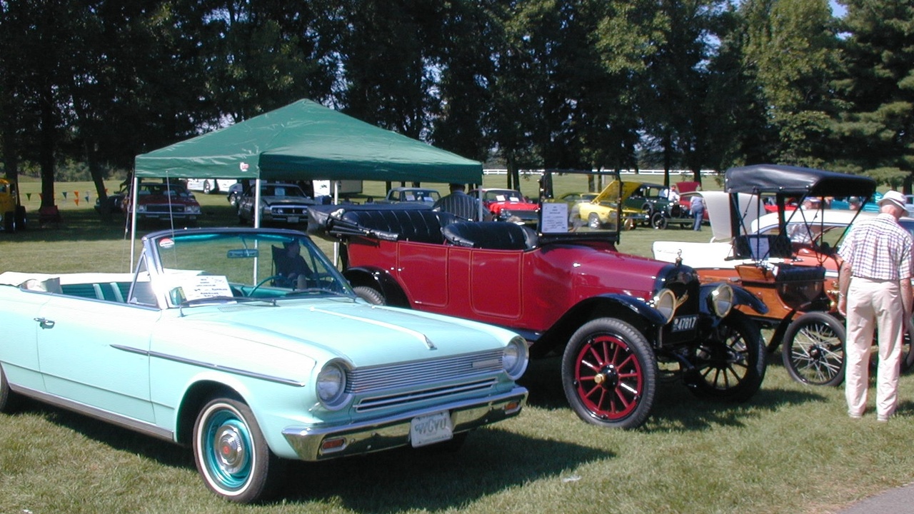 1960 American cars showing chrome-heavy styling and V8 engines
