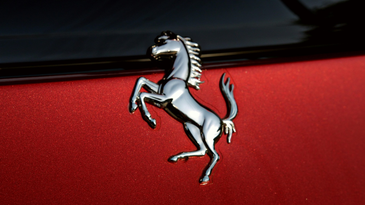 Pony car cornering on a winding road, showing agile handling