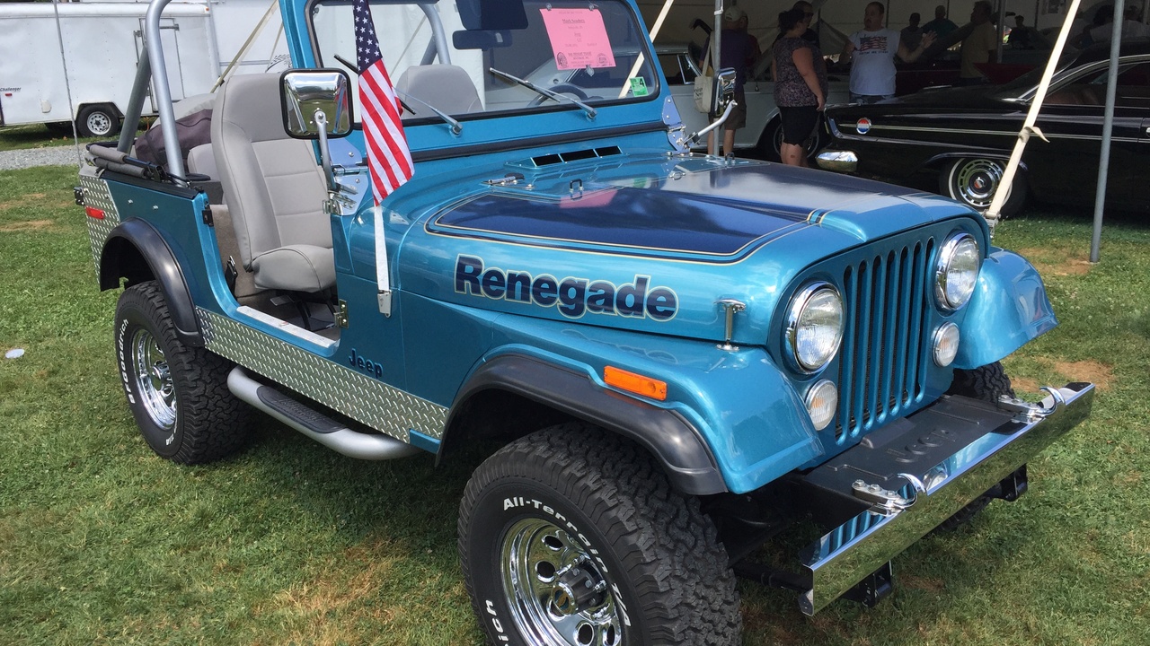 Off-road vehicle with winch and roof rack loaded for adventure