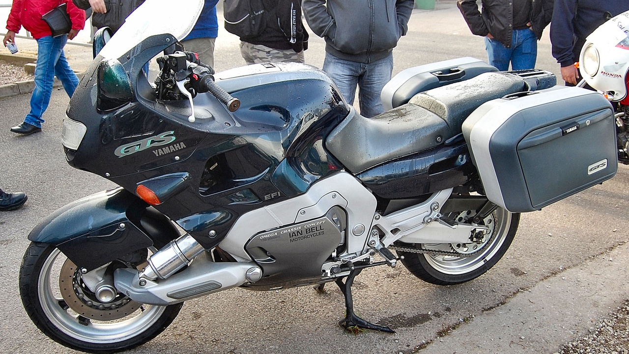 2010 sport-touring motorcycles on a highway, featuring BMW R1200RT and Kawasaki Concours 14