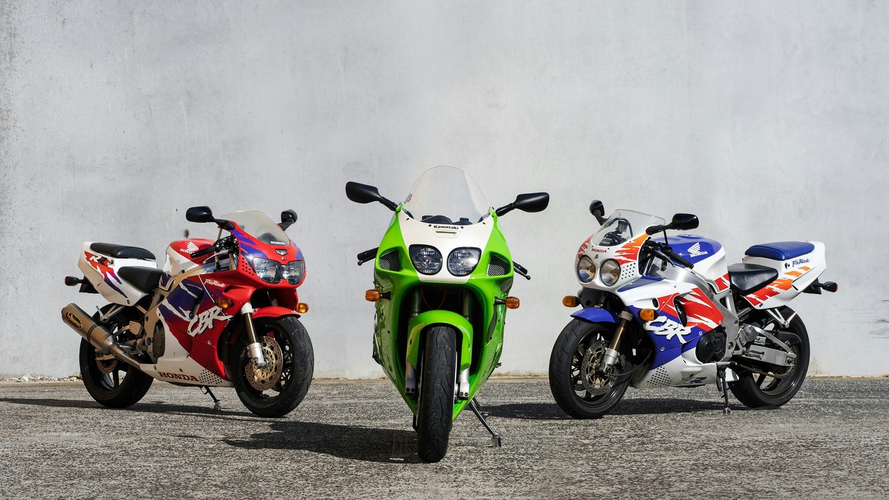 Row of 2012 superbikes including Ducati 1199 Panigale and Aprilia RSV4 on display.