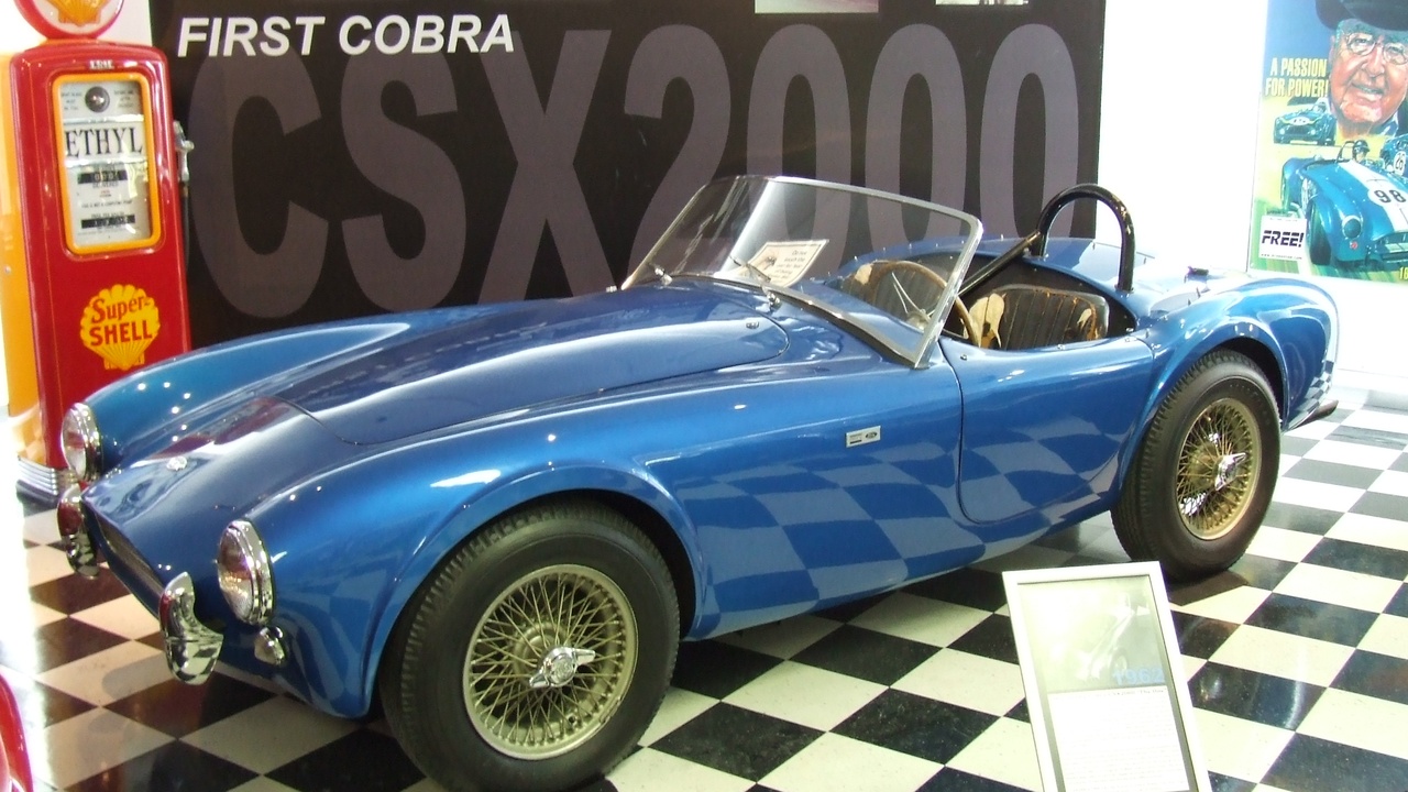 1962 Chevrolet Corvette and Ford Galaxie on American highway, representing 1962 American automotive style.