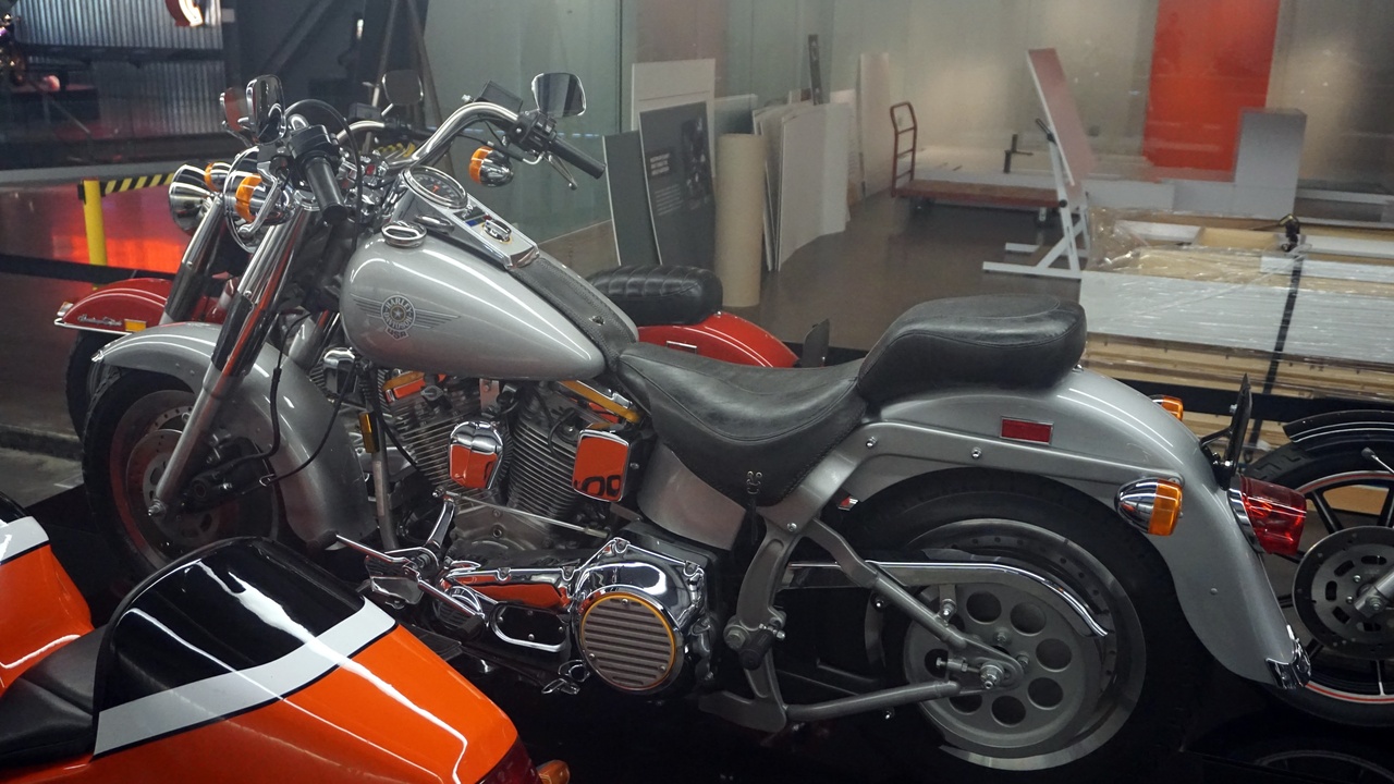 1990s cruiser and retro roadster motorcycles in urban setting