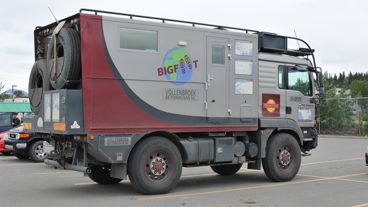 Open trunk showing extra cargo space in a car without a spare tire