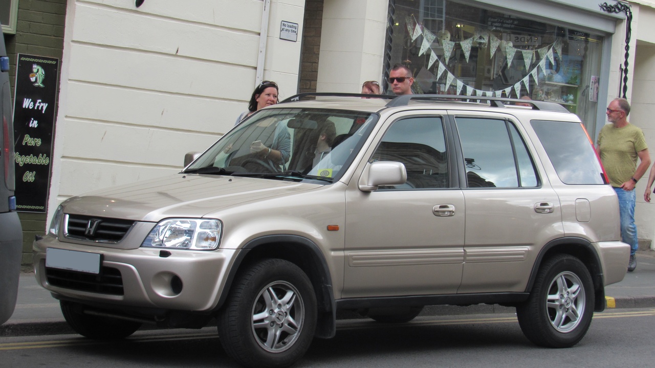 Three Honda SUVs on a suburban street showing versatility and family utility.