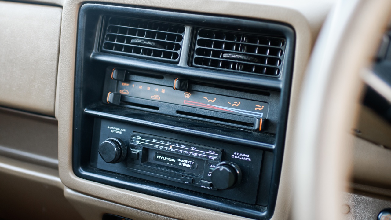 Hyundai Excel and Kia Pride on city streets