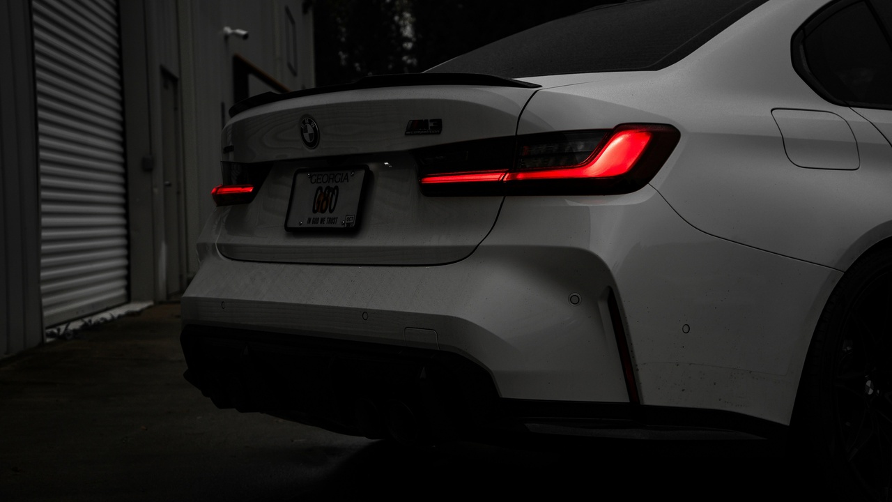 Close-up of glossy car paint after professional detailing showing high gloss and reflection