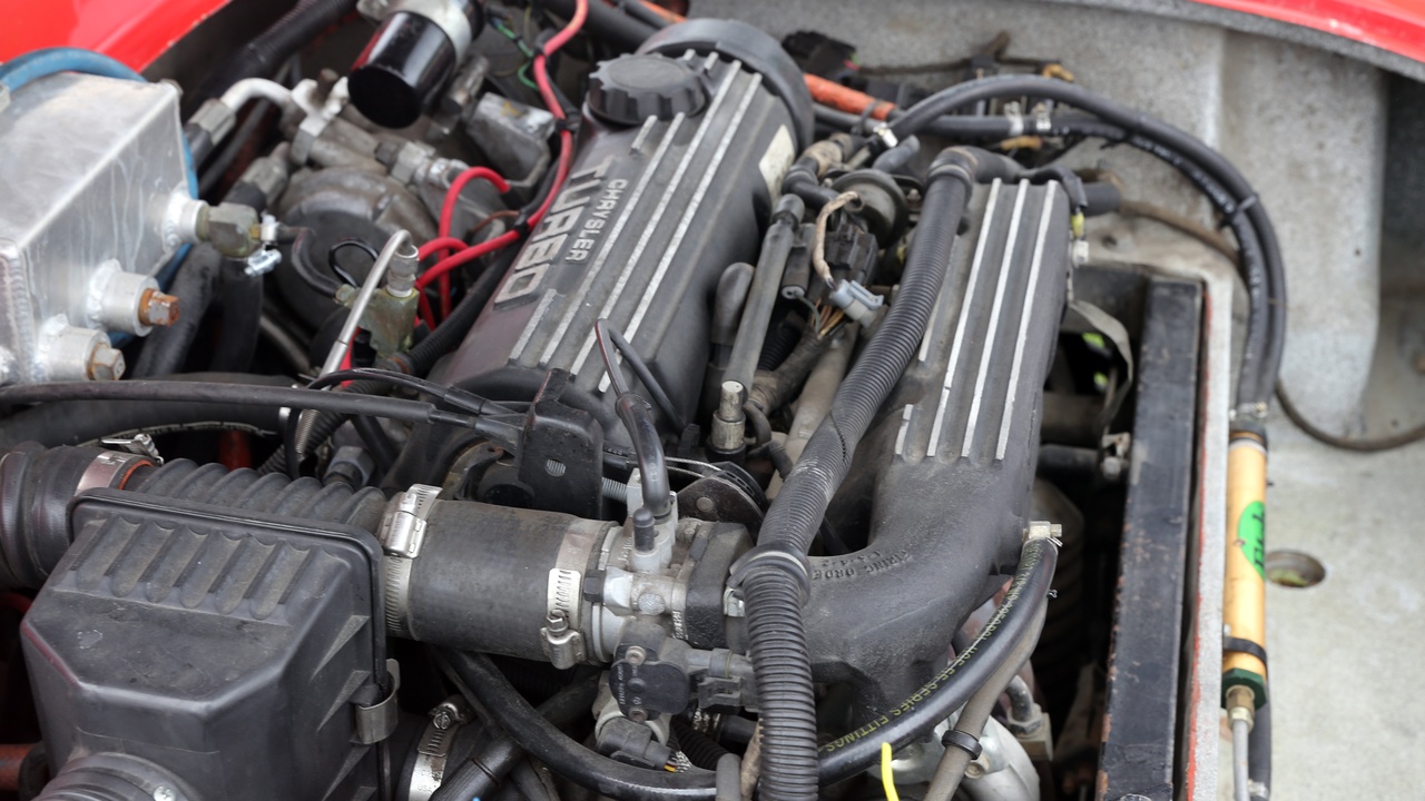 Mechanic working on a turbocharger and service costs illustration