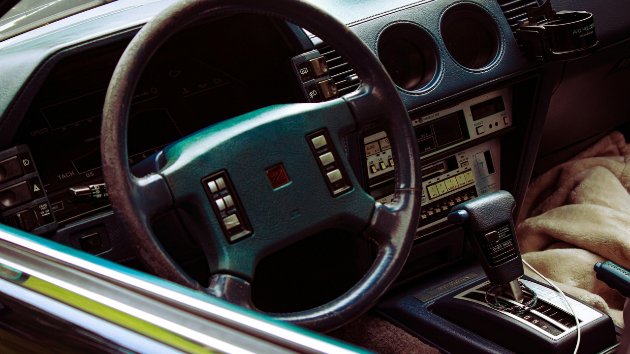 Classic 1983 car interior showcasing period dashboard layout and seating.