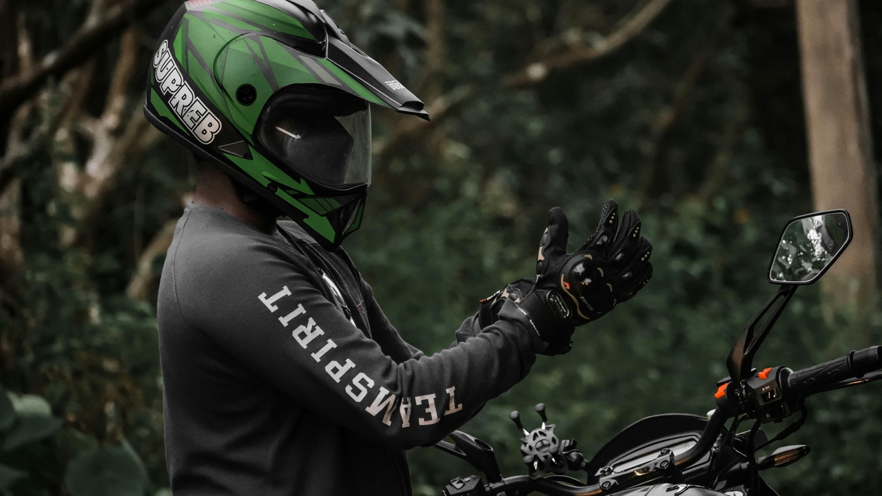 Motocross rider standing position showing handlebars and footpeg placement for control