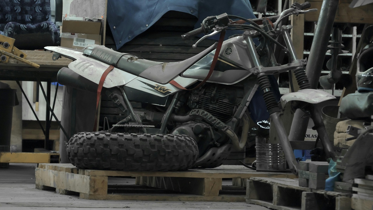 Motocross aftermarket parts and pit support area with tools and spares