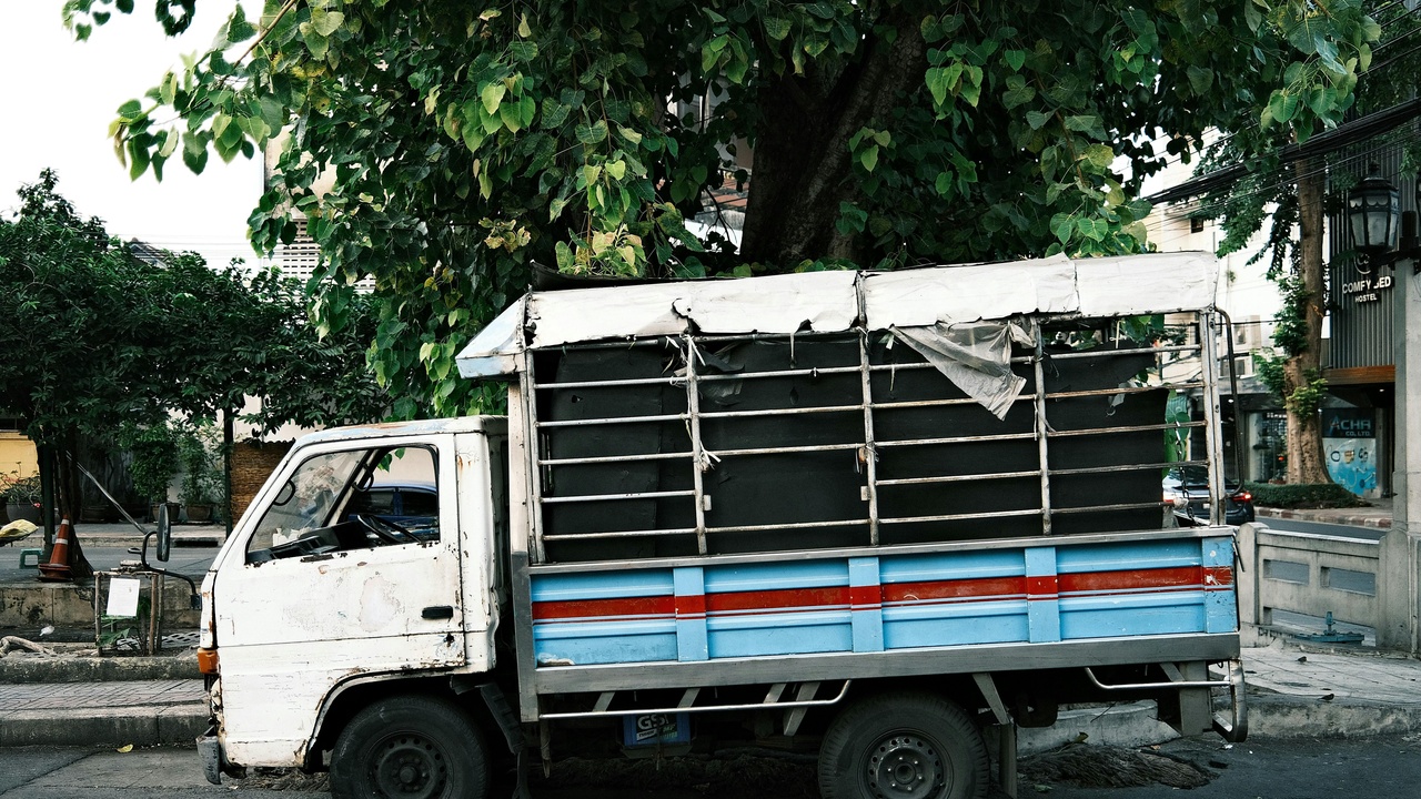 Regular cab pickup with ladder rack and toolboxes on an 8‑ft bed