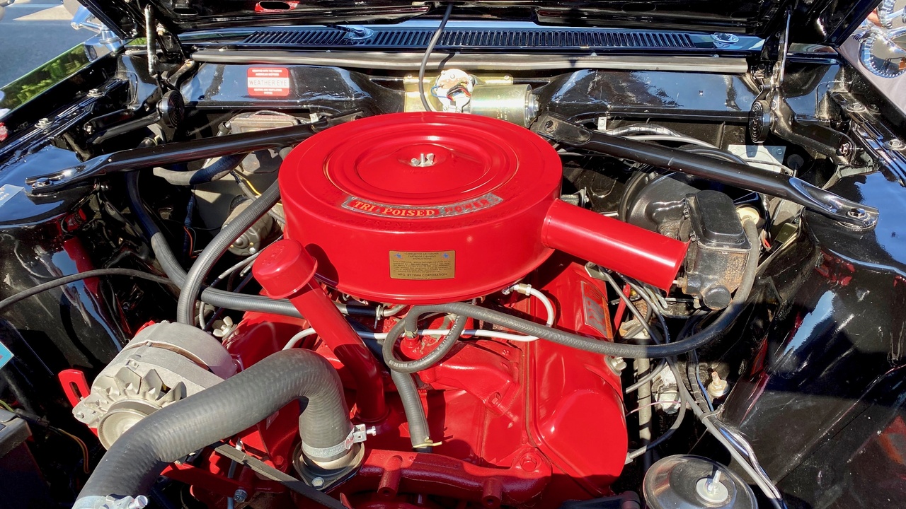 Close-up of a classic American V8 engine bay representing muscle car performance.