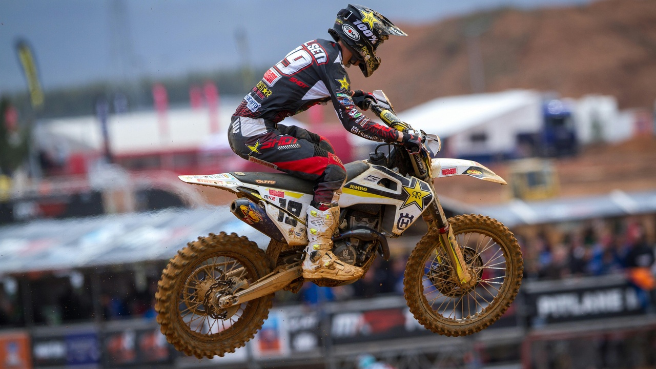 Motocross rider jumping and close-up of suspension showing fork travel
