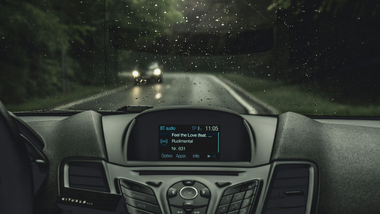 Driver looking at a digital dashboard display in a modern car