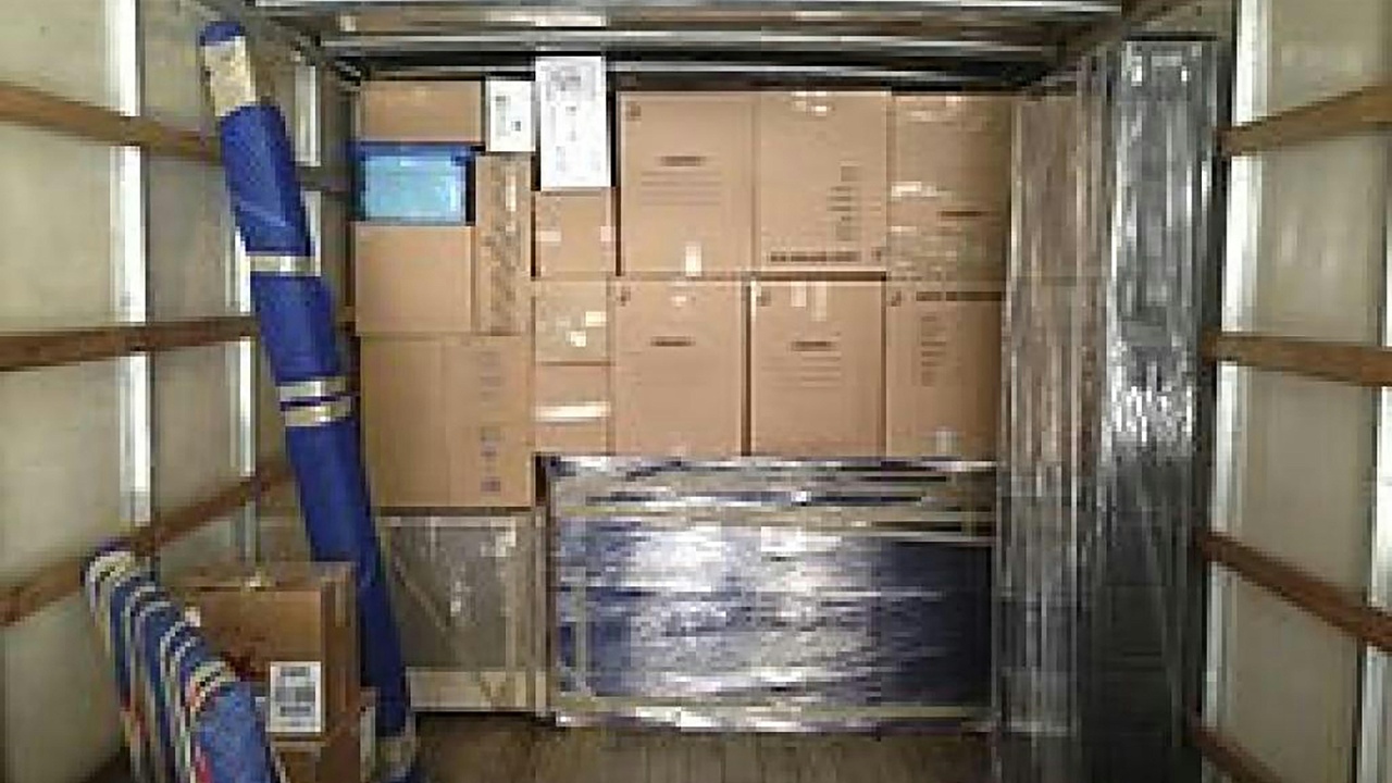 High-roof full-size cargo van interior showing shelving and large cargo volume