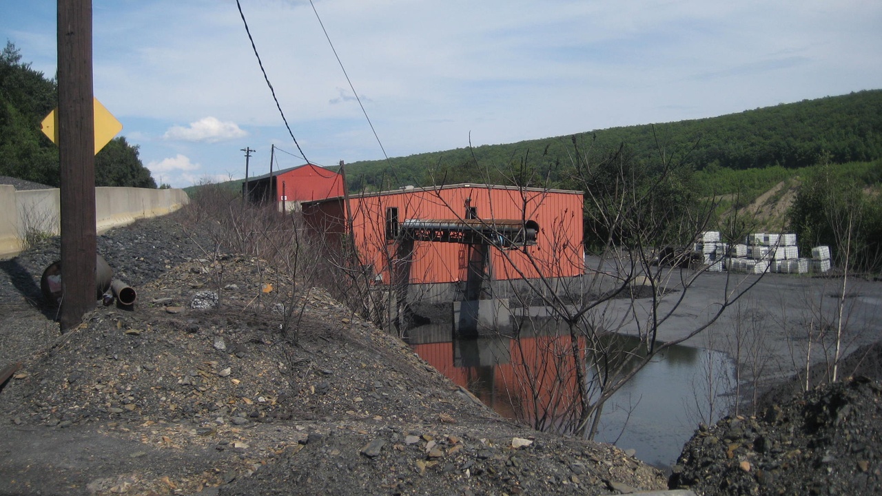 Truck bed with roll-up tonneau open showing quick access to cargo