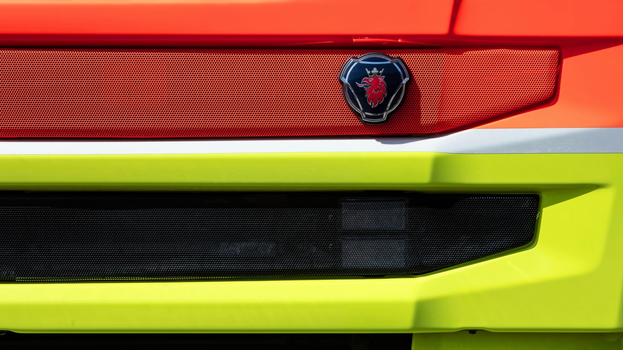 Sporty alloy wheel with large painted multi-piston caliper visible behind spokes.