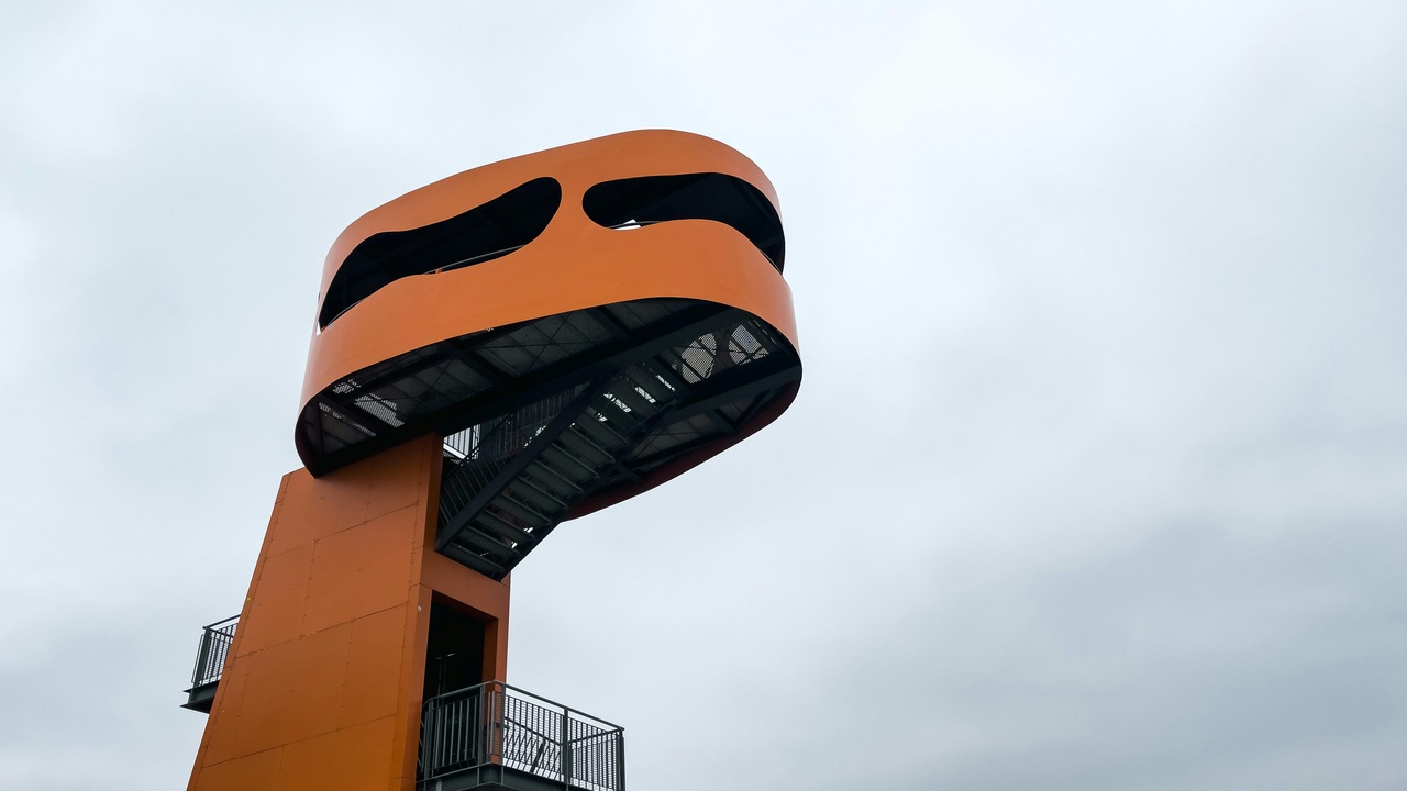 A polished aftermarket strut brace in an engine bay, highlighting perceived build quality and practical upgrade appeal