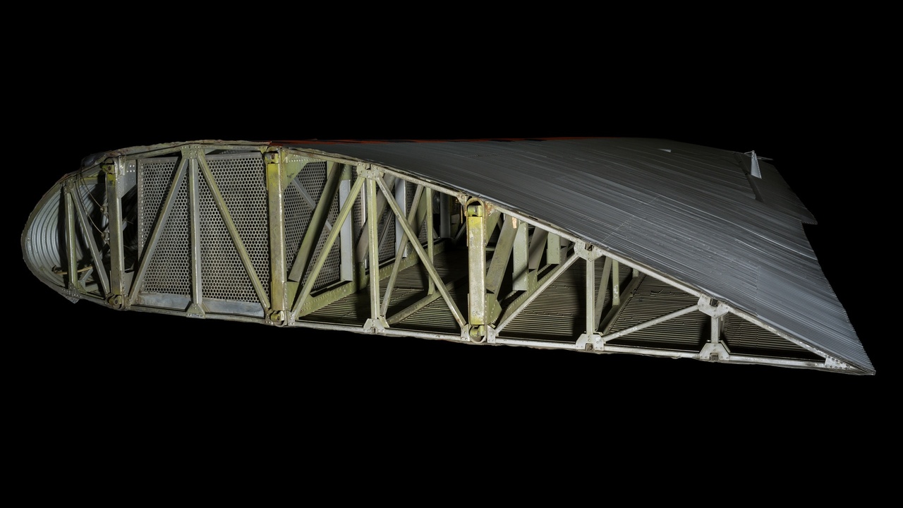 A close-up of a locked rooftop bike mount securing a bicycle