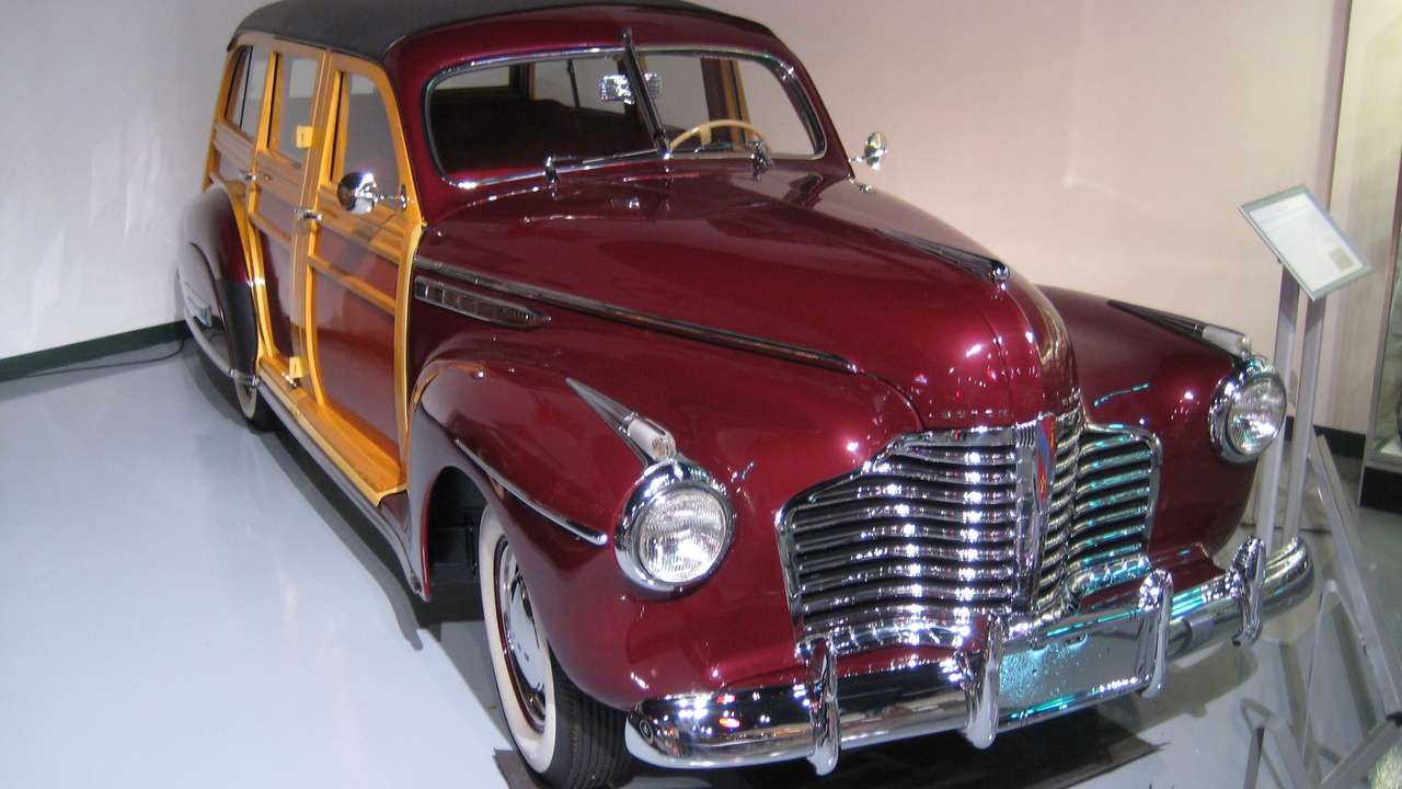 1941 woody station wagon and a light-duty Ford truck, illustrating multipurpose civilian and commercial vehicles of the era