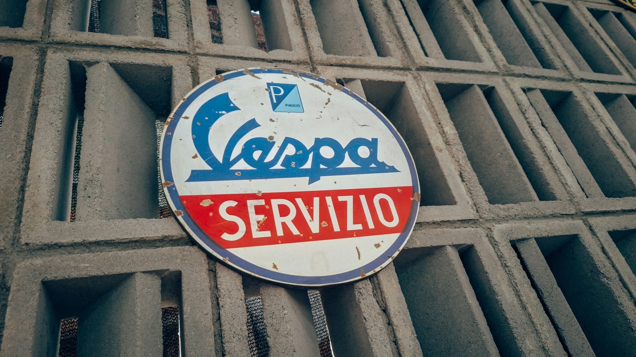 Vespa 150 GS, Cagiva Elefant and Moto Morini on display at a vintage rally