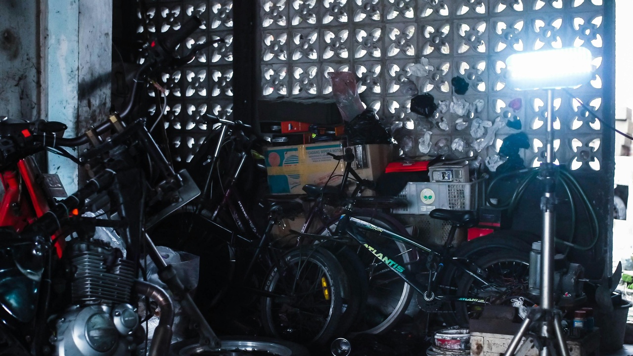 Motorcycle maintenance tools on a workshop bench showing practical upkeep