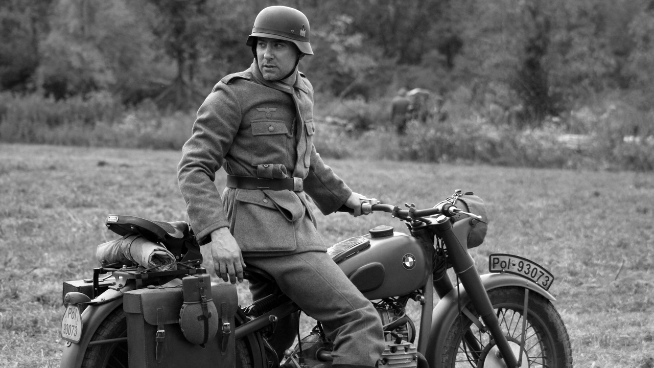 Military sidecar rig parked on a dirt road, showing reinforced frame and radio box in the sidecar