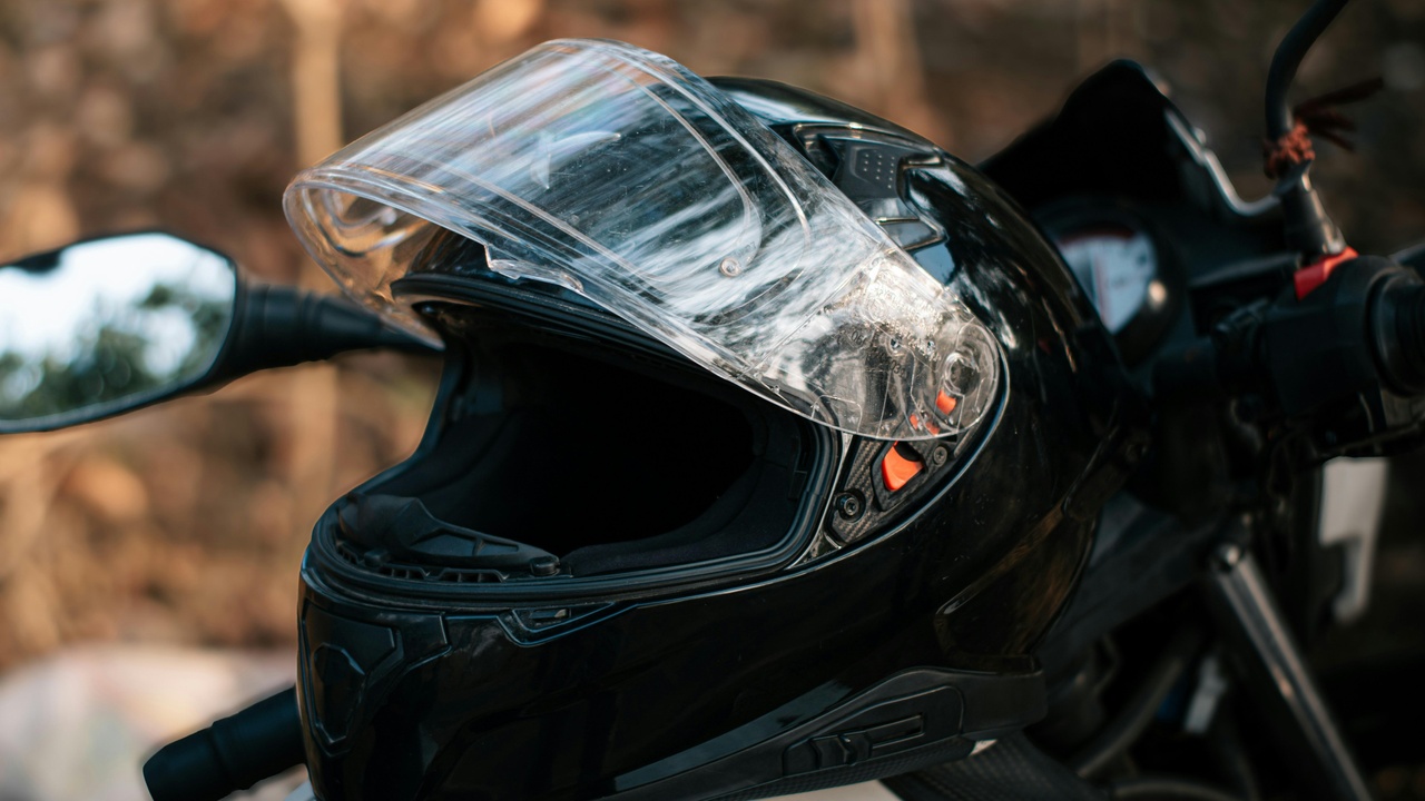 Motorcycle with small windscreen riding in the rain showing weather protection