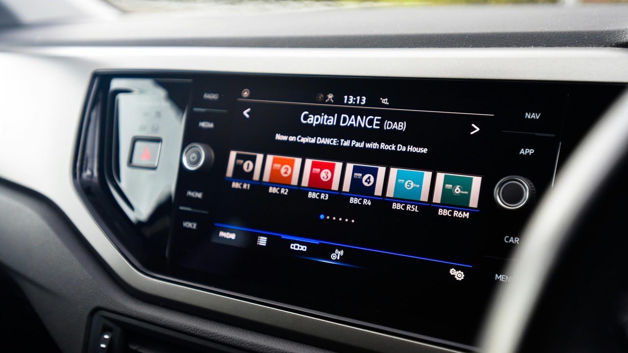 Aftermarket touchscreen showing Apple CarPlay and backup camera feed