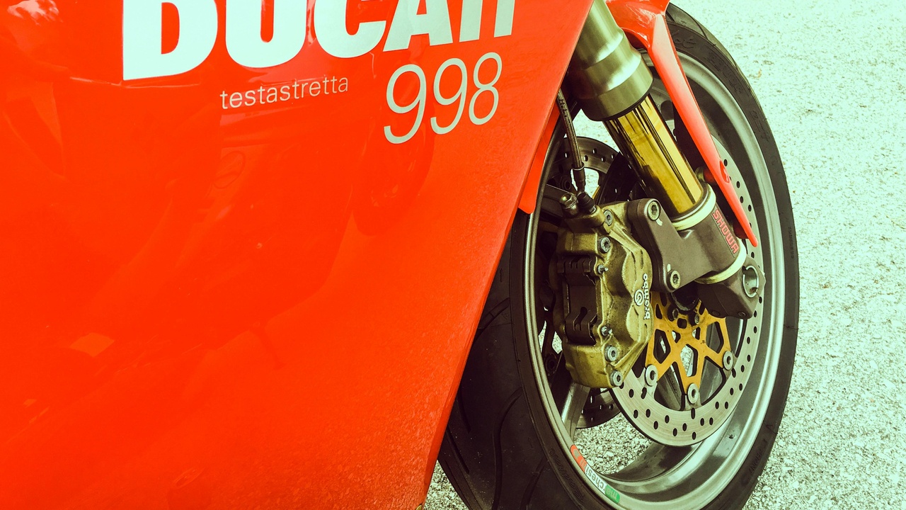 Ducati Monster and Moto Guzzi Le Mans parked for a weekend ride