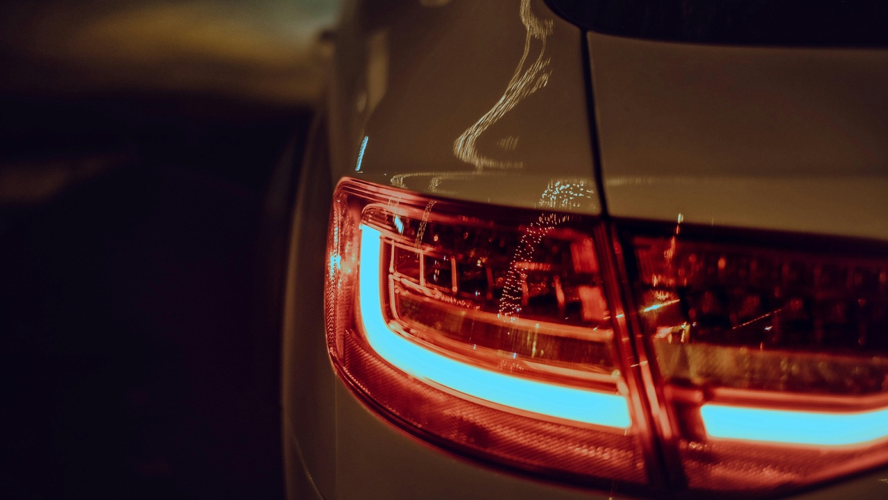 Comparison of LED and halogen headlight bulbs showing energy efficiency