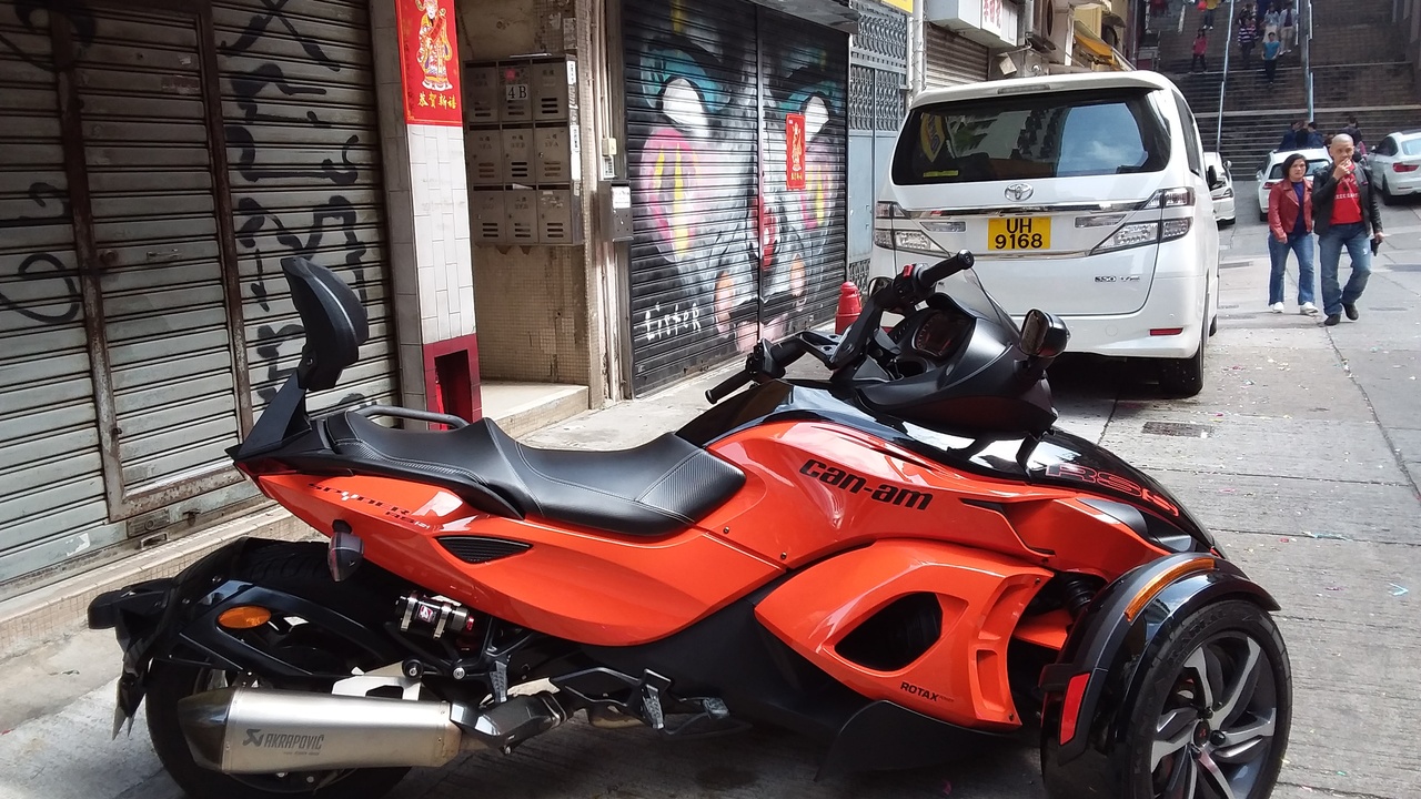 Close-up of a Can-Am Rotax engine and three-wheeler drivetrain