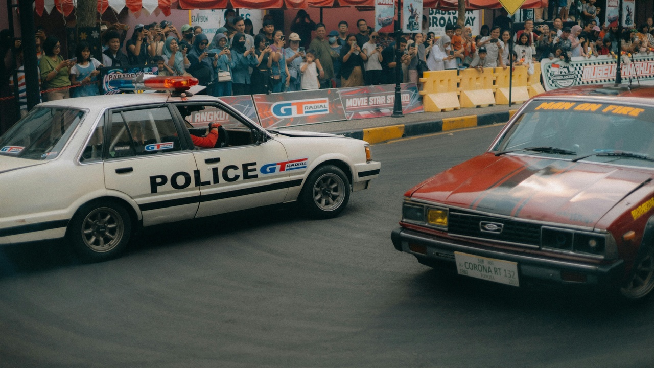 Three classic 1982 sports cars parked side by side — Porsche 911 SC, Ferrari 308 GTS, Audi Quattro