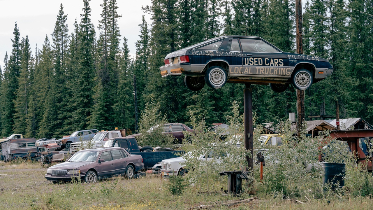 Used cars lined up at a dealership lot