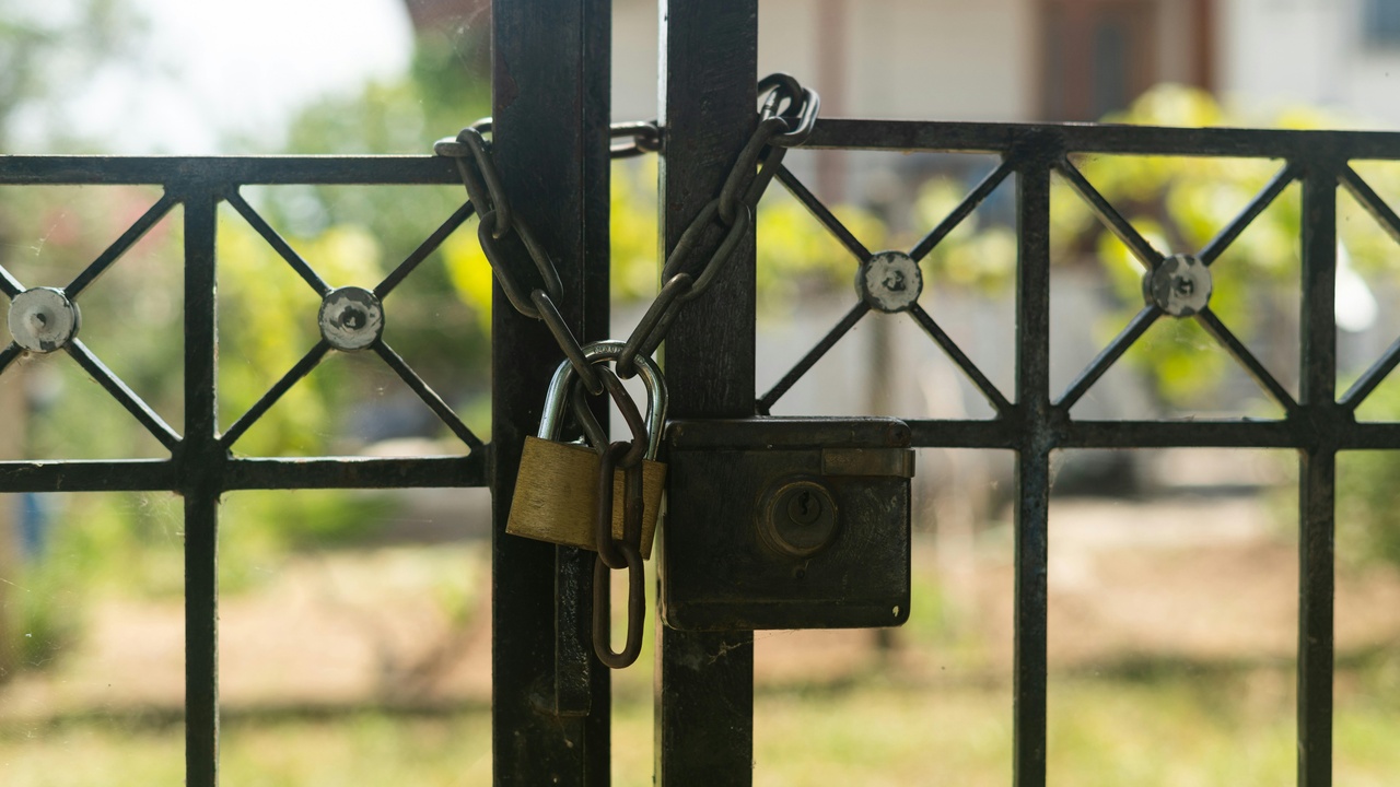 Car key fob next to steering wheel showing security features