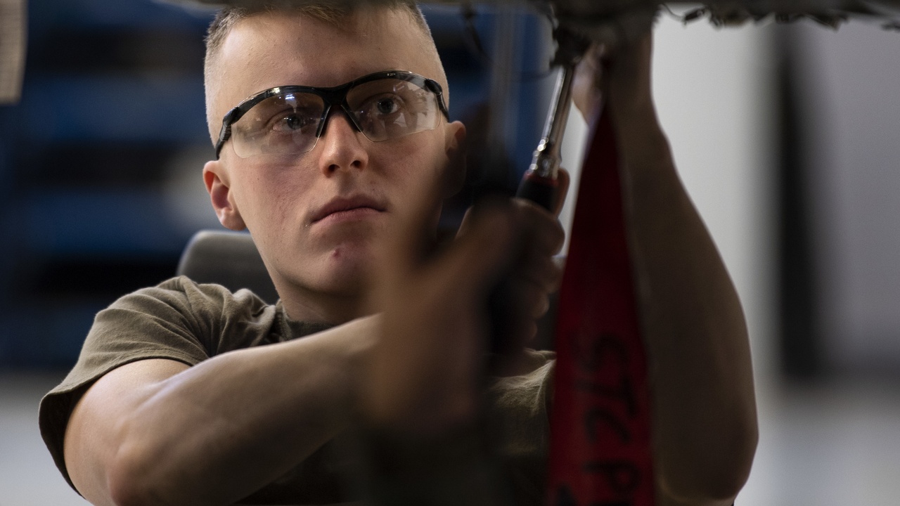 Close-up of engine components highlighting safety inspection and supercharger pulley stress