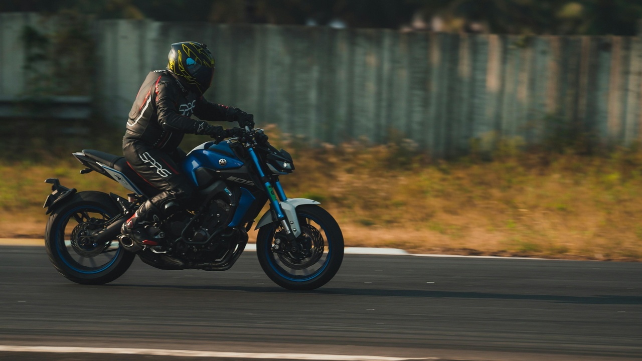 A 2021 sport motorcycle on the track showcasing aerodynamic fairings and rider in full lean