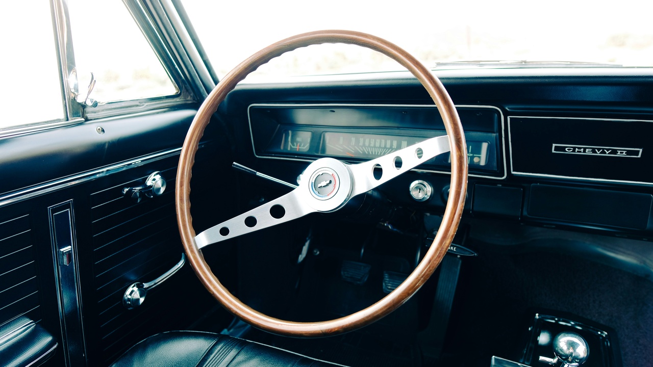 Collage of 1960s car design including Jaguar E-Type profile and classic automotive styling