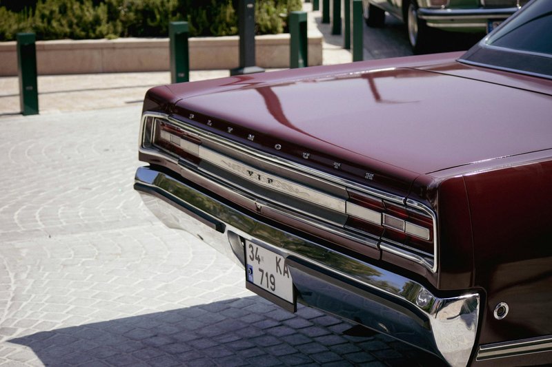 Rear view of a vintage Plymouth car at the Istanbul Classic Car Show, featuring a retro aesthetic.