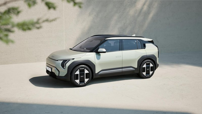 A sleek electric SUV parked in a minimalist outdoor environment, showcasing modern design.