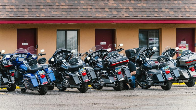 Several touring motorcycles parked in front of a motel in Williams, Arizona, along Route 66.