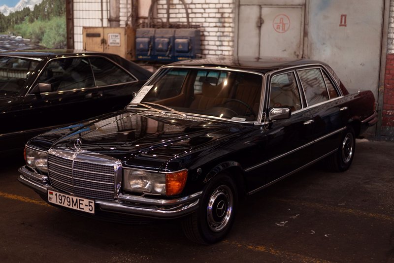 Classic Mercedes-Benz 450SEL displayed indoors, showcasing vintage automotive elegance.