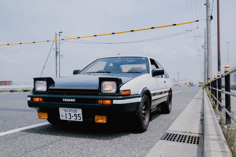 Classic Toyota Trueno parked on an urban street, exuding retro charm and nostalgia.