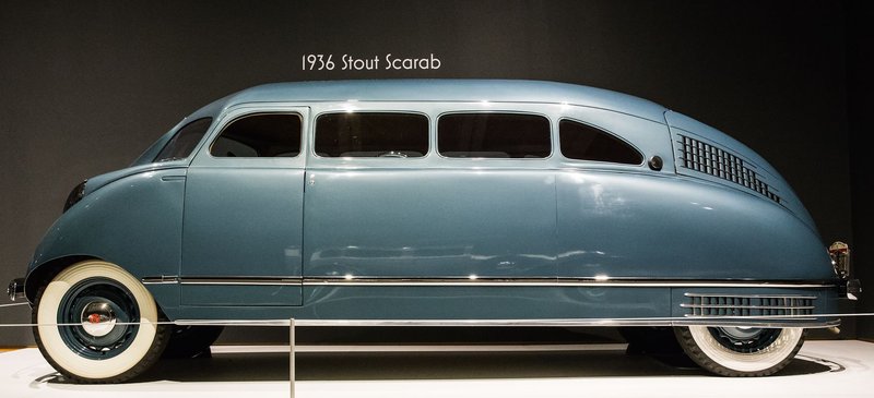 Side view of 1936 Stout Scarab, a classic minivan with unique design.