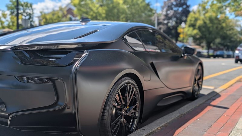 Elegant BMW i8 with matte black finish parked in Ridgewood, NJ, epitomizing luxury and modern automotive design.