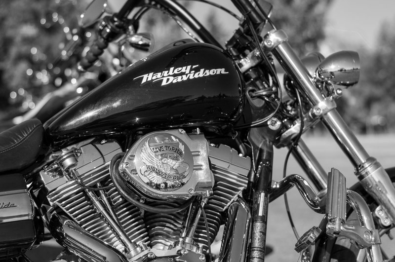 Black and white close-up of a vintage Harley-Davidson motorcycle engine showcasing its iconic design.