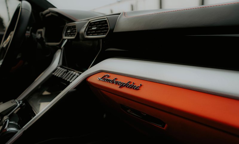 Close-up of a Lamborghini dashboard showcasing luxury and modern design details.