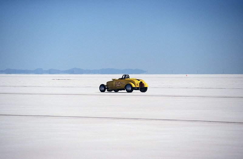 Vintage yellow hot rod racing on the Bonneville Salt Flats. High speed adventure.
